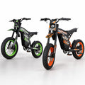 Green and orange Buzymoto DAT70 electric bikes displayed side by side on a clean white studio background.